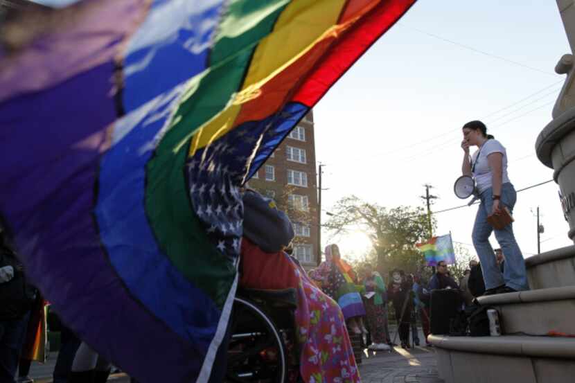 Meg Hargis addressed the crowd around the Legacy of Love Monument during a marriage-equality...