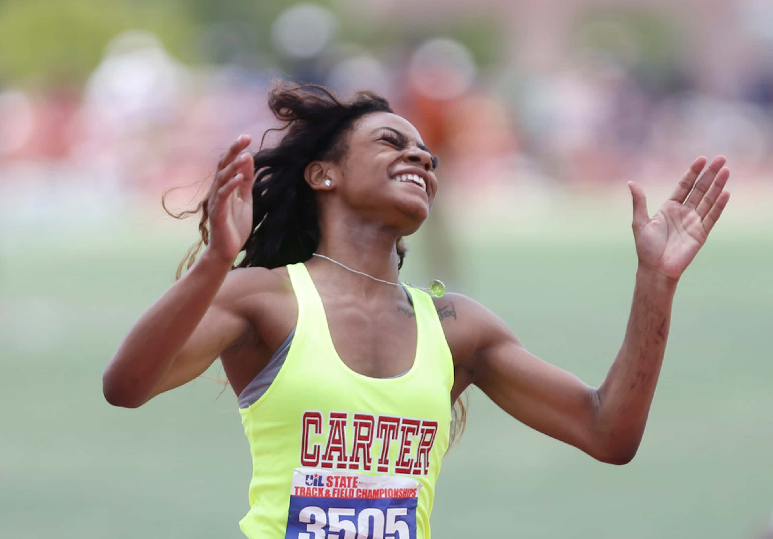 Carter's Sha'Carri Richardson celebrates after winning in the Class 4A girls  100-meter...