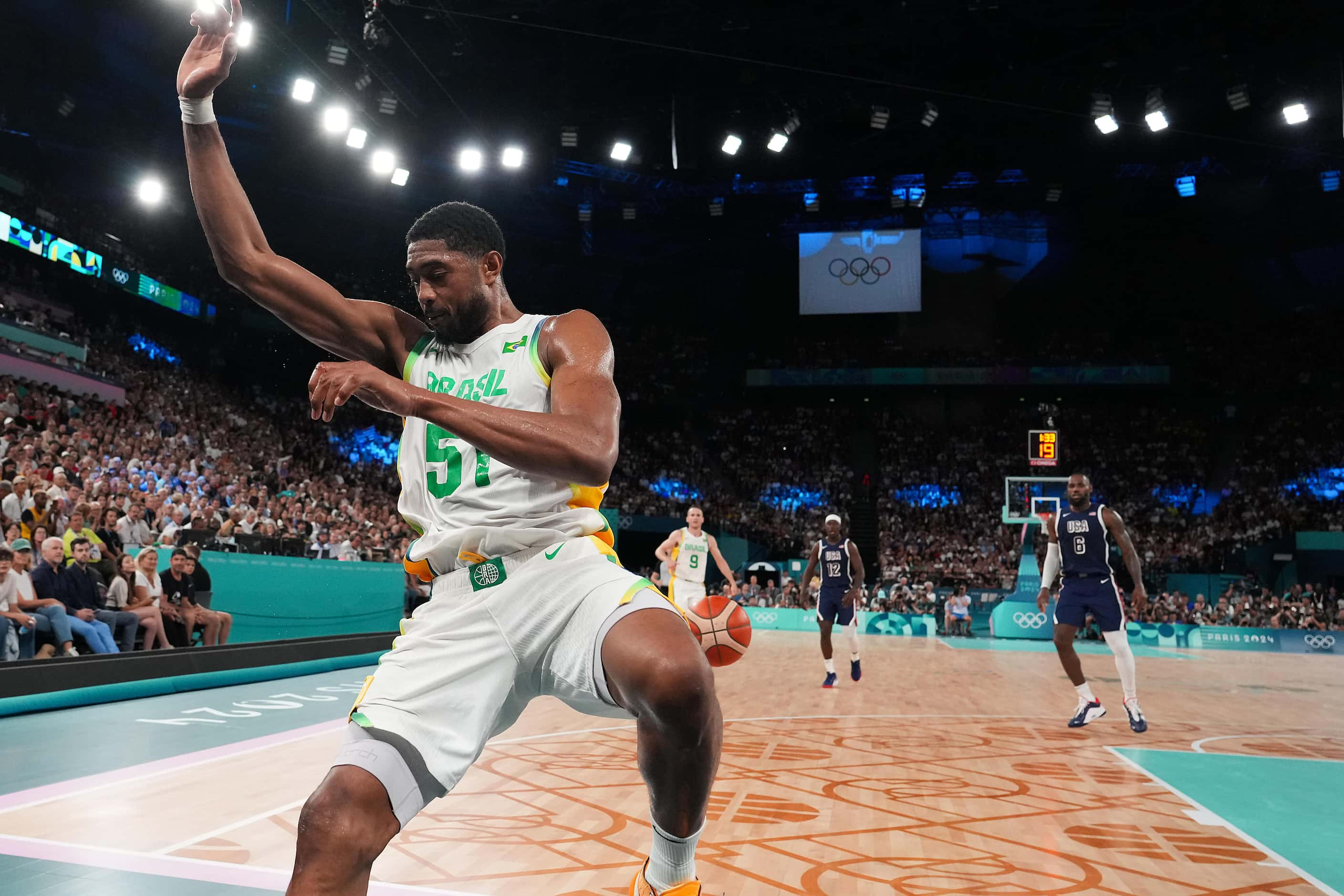 Bruno Caboclo (51) of Brazil tries to save a bal from going out of bounds during a men’s...