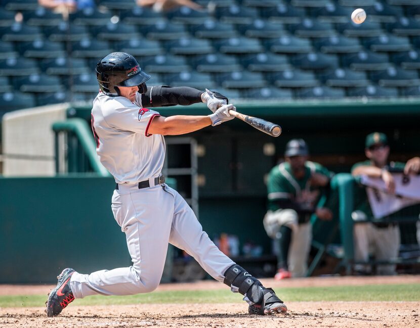 Hickory Crawdad's Justin Foscue (20) hits a home run during the game with the Greensboro...