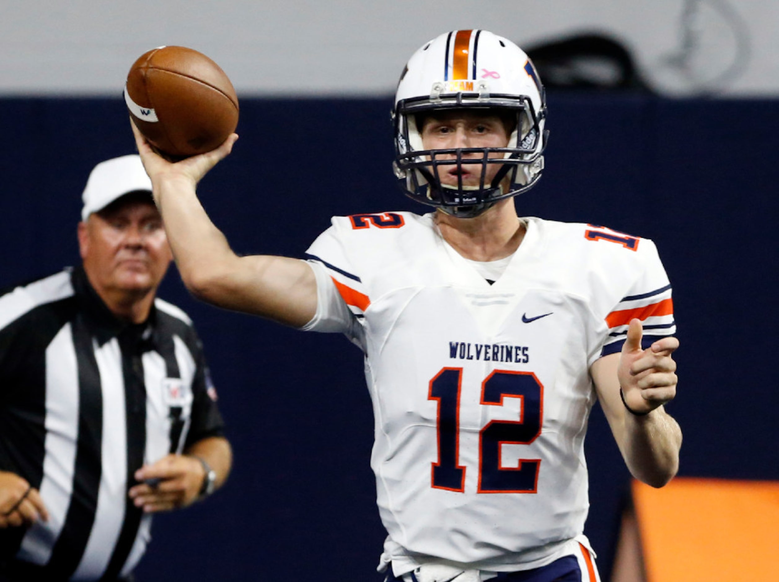 Frisco Wakeland High QB Cooper Chandler (12) throws a pass during the first half of a high...