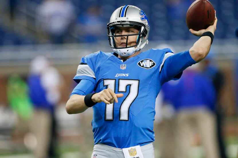 Detroit Lions quarterback Kellen Moore warms up before an NFL football game between the...