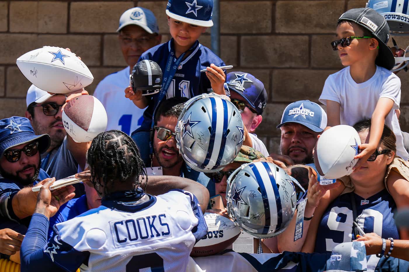 Fans clamor for an autography from Dallas Cowboys wide receiver Brandin Cooks  following the...