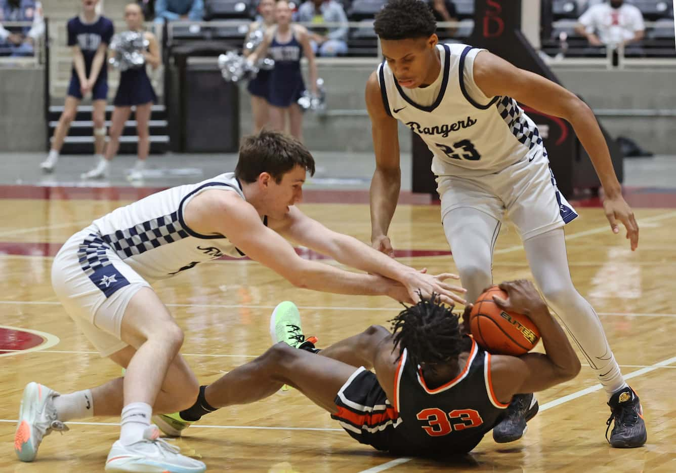 Frisco Lone Star G Ryan Hoad (2, left) and G Trent Perry (23) try to wrestle the ball away...