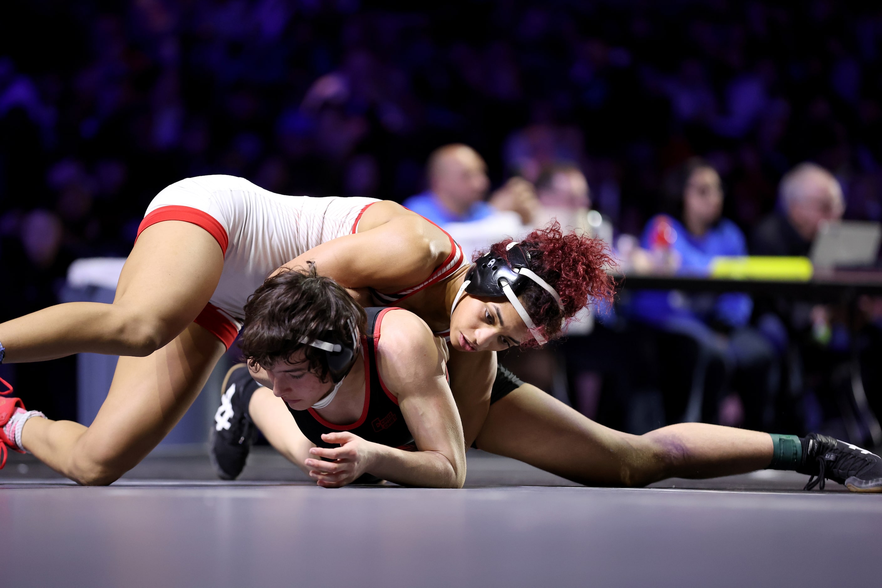 Jania Dunigan of Arlington Martin (white) competes against Sarah Conner of Richardson Lake...