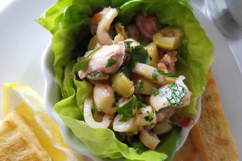 Olive-studded ceviche arrives in a lettuce shell at Del Porto Ristorante, a top-flight...