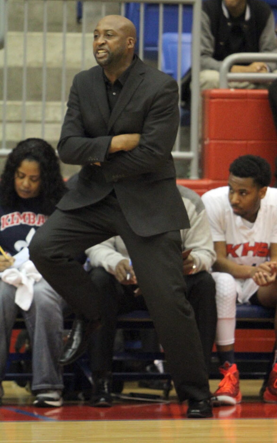 Dallas Kimball head coach Nick Smith tries to encourage his team during first half action...