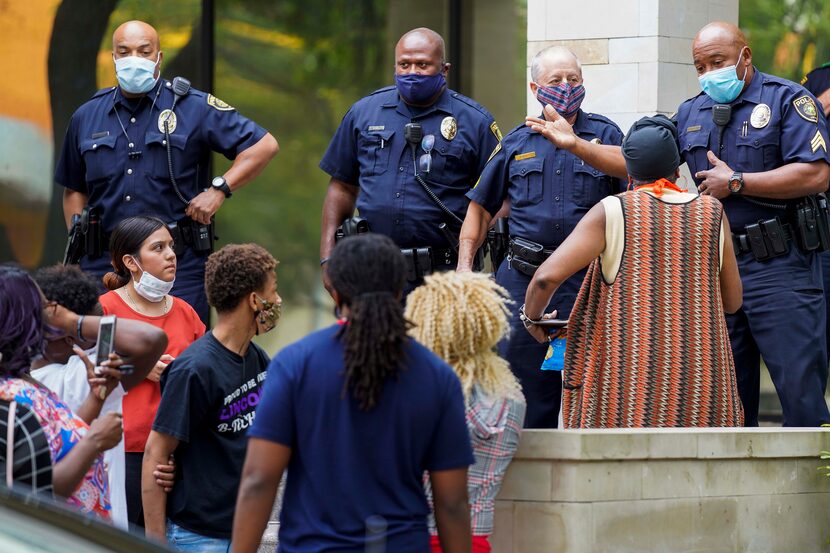 A Dallas ISD police officer asked  protesters to leave after activist Carlos Quintanilla...