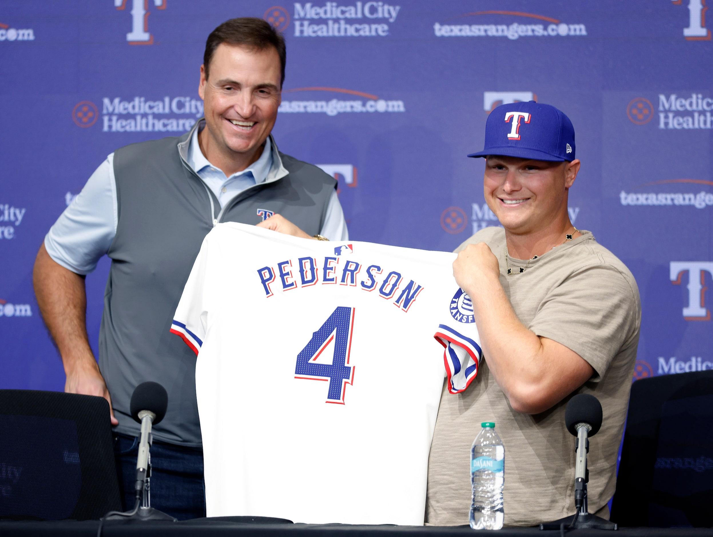 Rangers President of Baseball Operations Chris Young (left) presents a new jersey to...