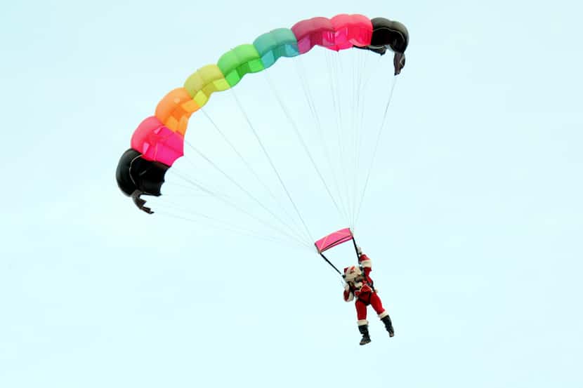 It's a bird, it's a plane, it's...Santa Claus? The man himself parachutes into the Frisco...