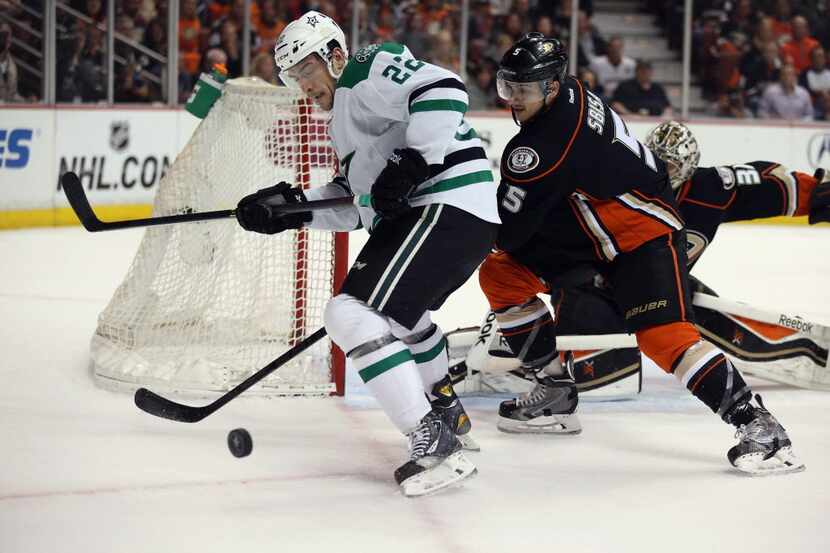 ANAHEIM, CA - APRIL 25: Colton Sceviour #22 of the Dallas Stars is pursued by Luca Sbisa #5...
