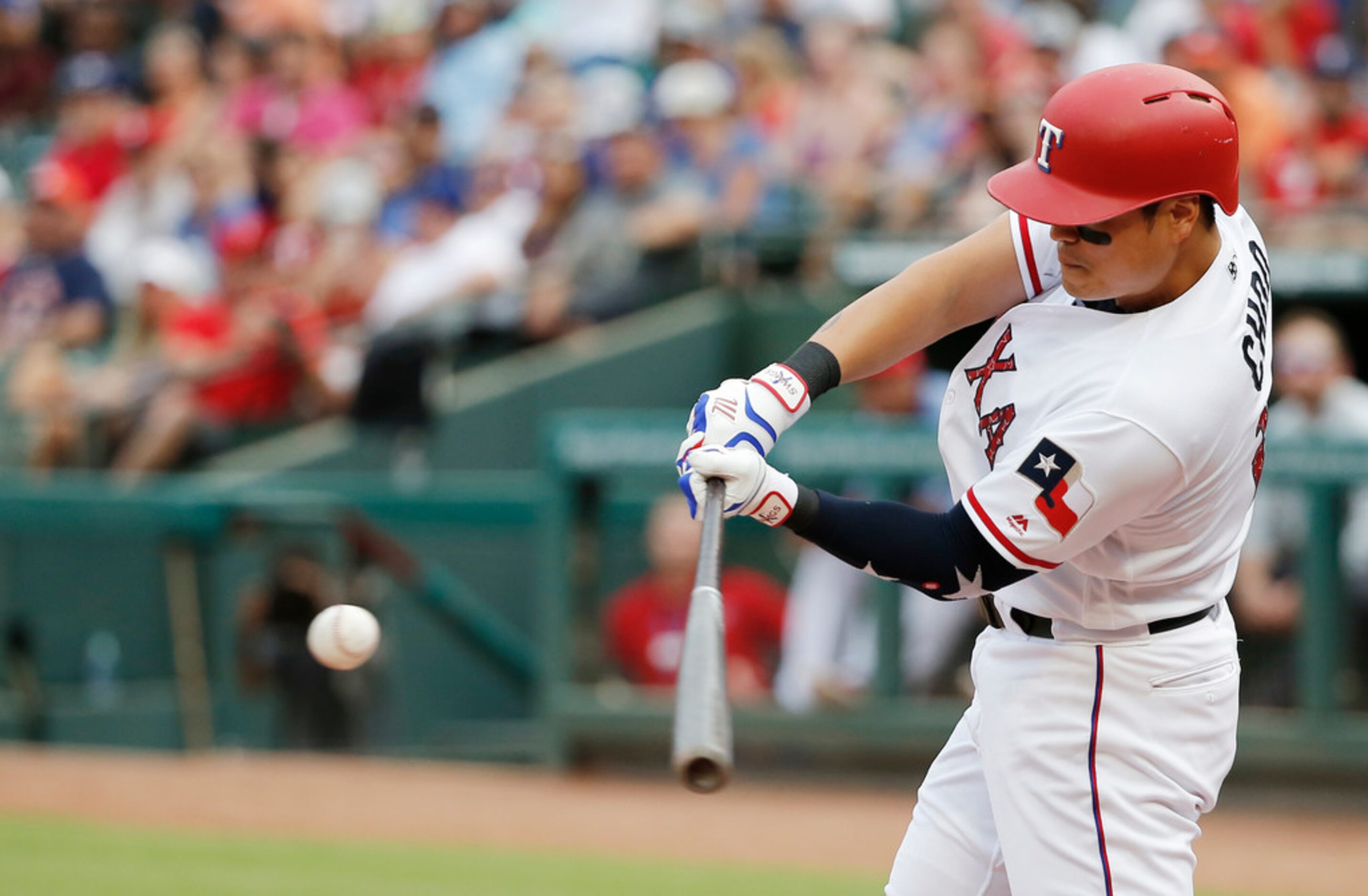 Texas Rangers' Shin-Soo Choo hits a solo home run during the third inning of the team's...