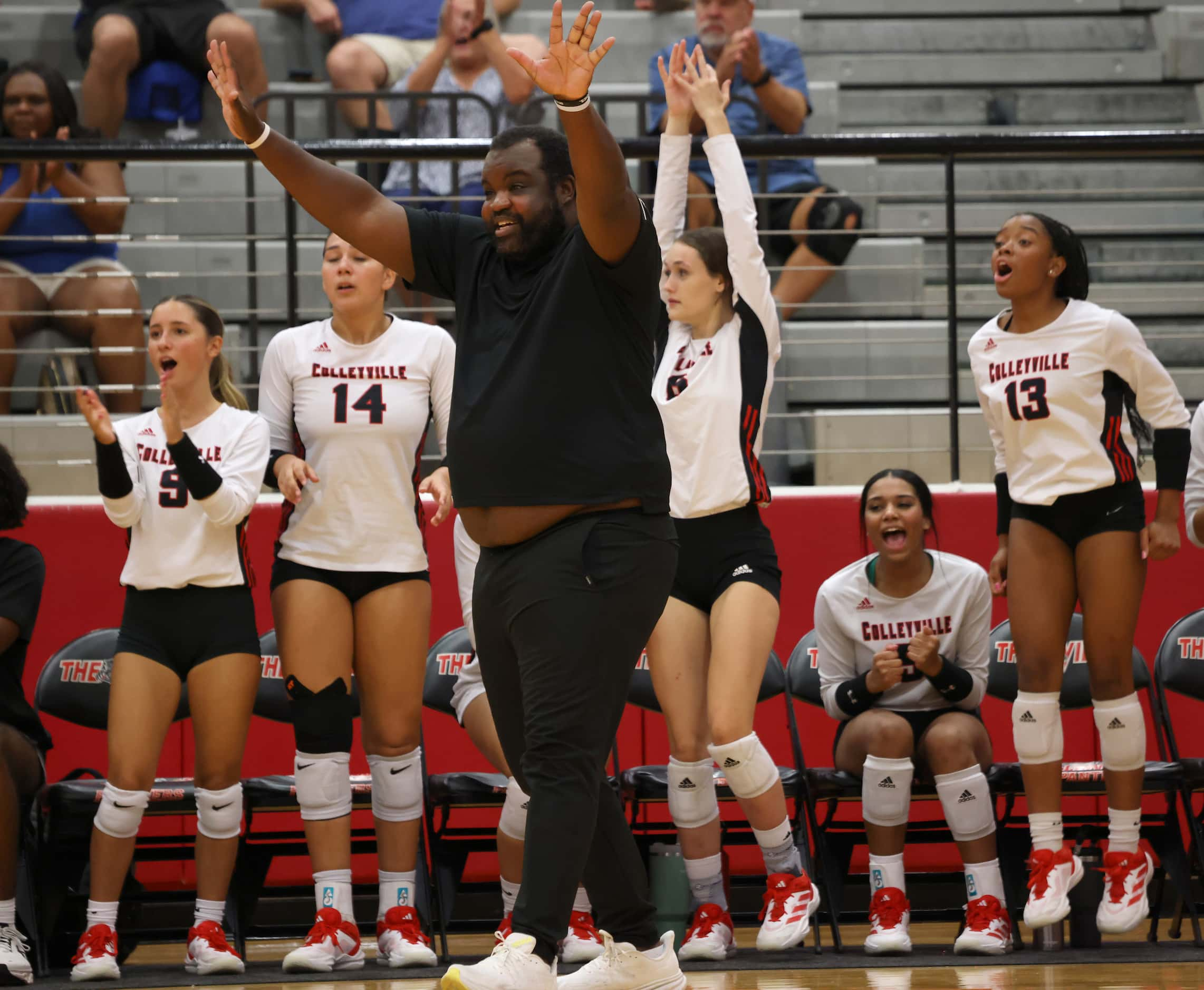 Colleyville Heritage head volleyball coach Josh McKinney reacts in front of the team bench...