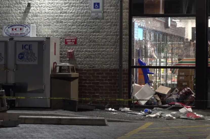 An image from the scene where five masked thieves rammed a pickup into a 7-Eleven and yanked...