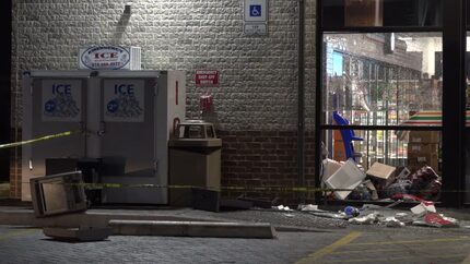 An image from the scene where five masked thieves rammed a pickup into a 7-Eleven and yanked...