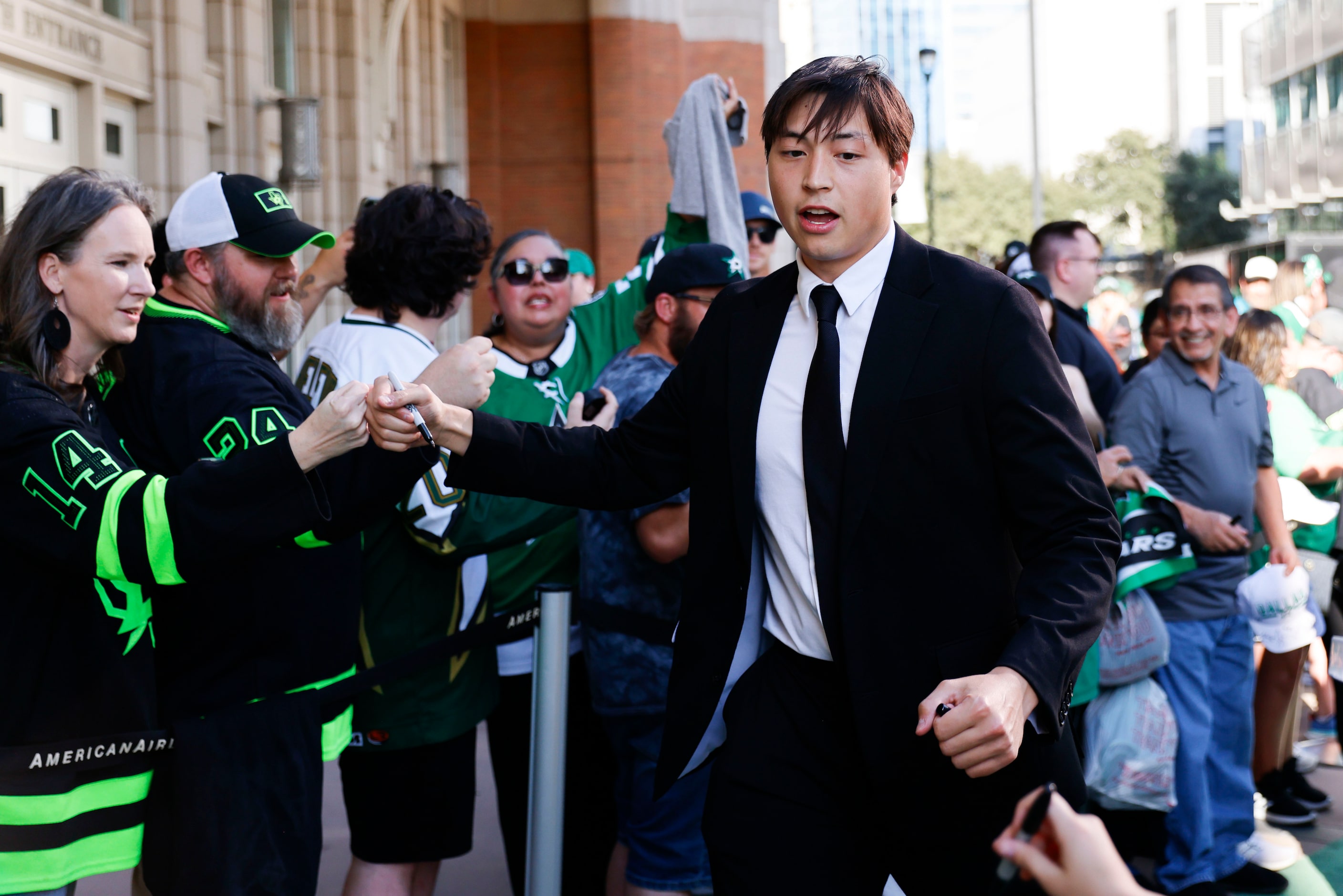 Dallas Stars left wing Jason Robertson interacts with the crowd during the team’s home...