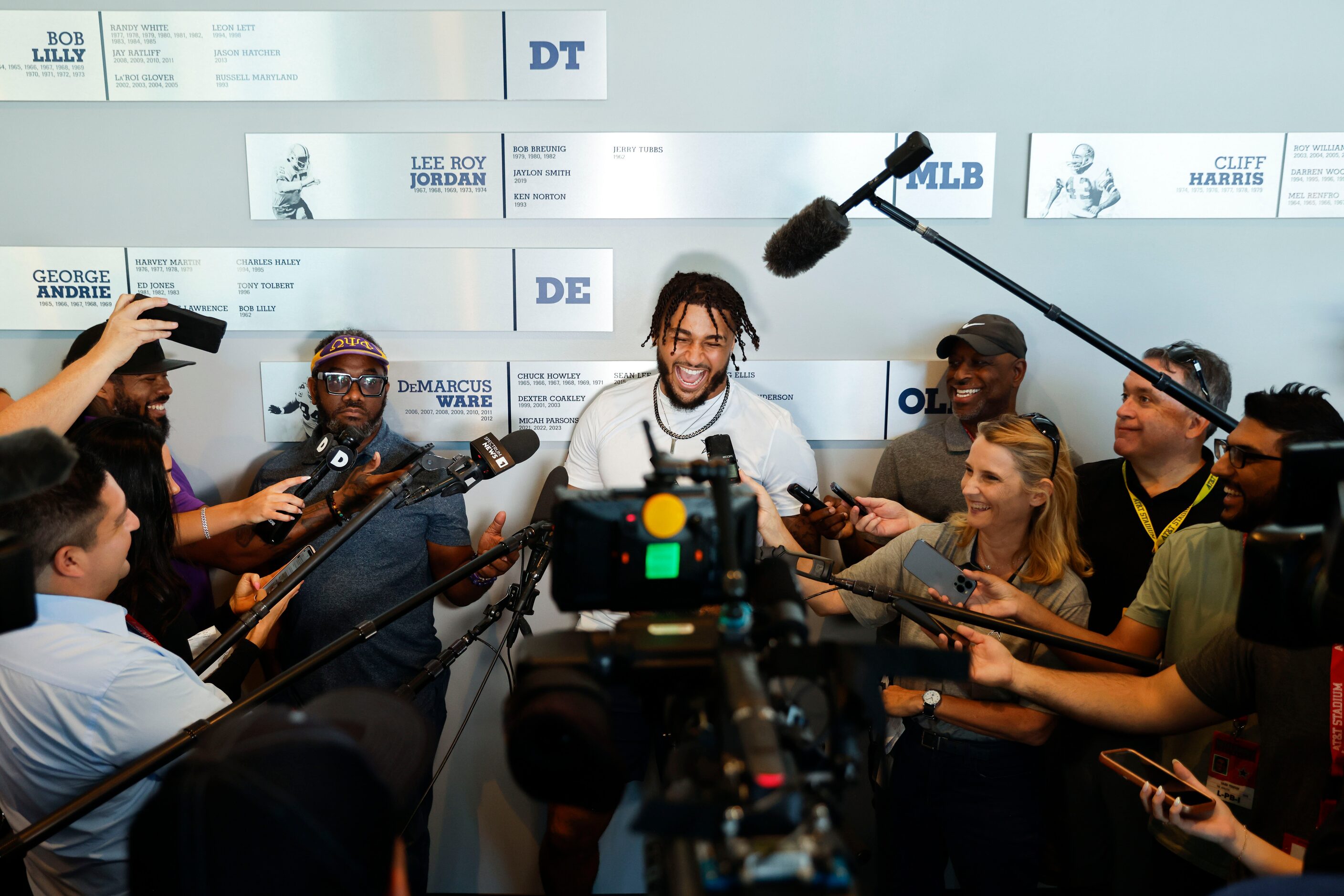 Dallas Cowboys defensive end Marshawn Kneeland shares a laugh with the members of the press...