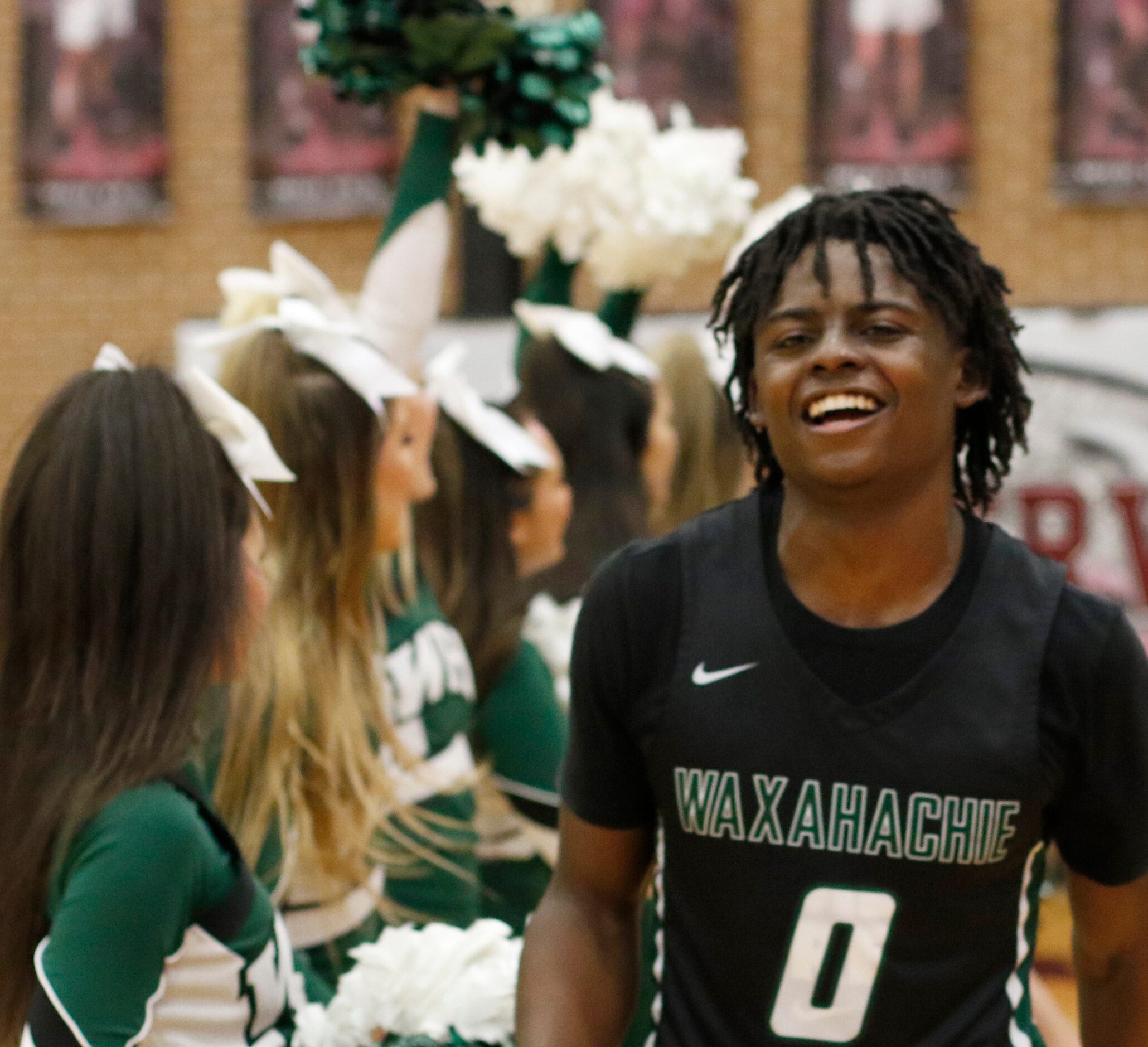 Waxahachie guard BJ Francis (0) was all smiles as he runs through a spirit line of...