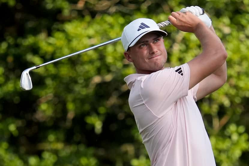 Ludvig Aberg, of Sweden, watches his tee shot on the 15th hole during the second round of...