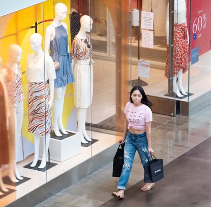 A young woman shops at NorthPark Center in Dallas. 