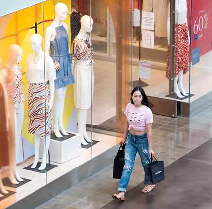 A young woman shops at NorthPark Center in Dallas. 