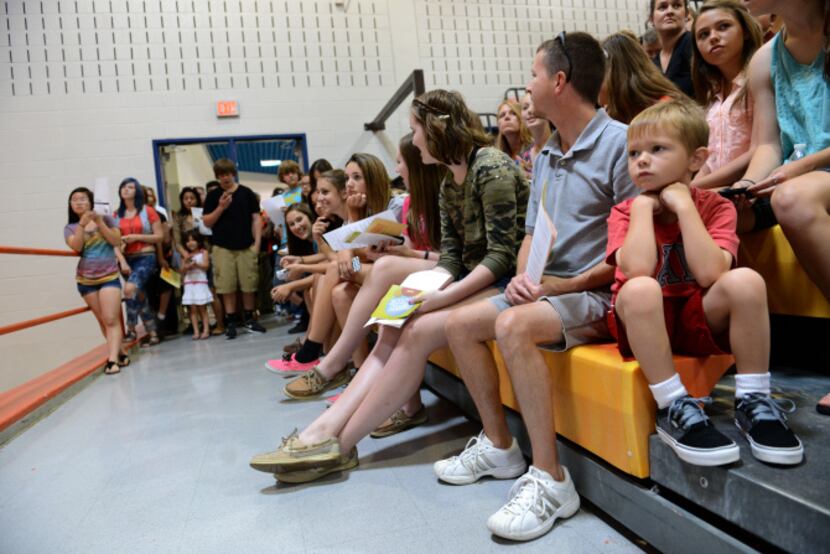 Rockwall High School's incoming freshmen and their parents attend a pep rally during the...