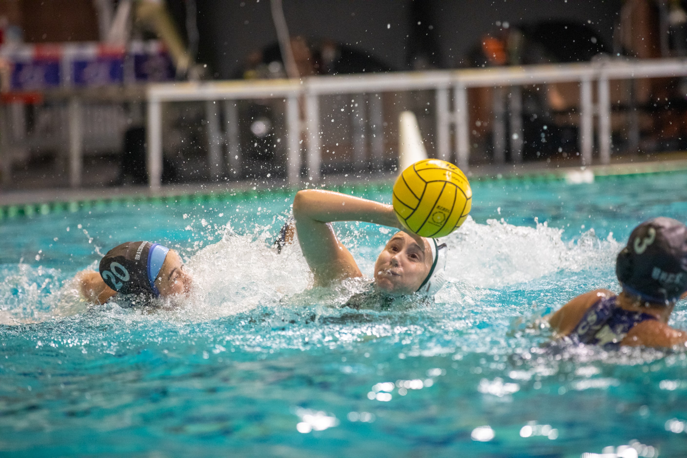 Southlake Carroll utility Sydney Rubin, center, battles for the ball against Clute...