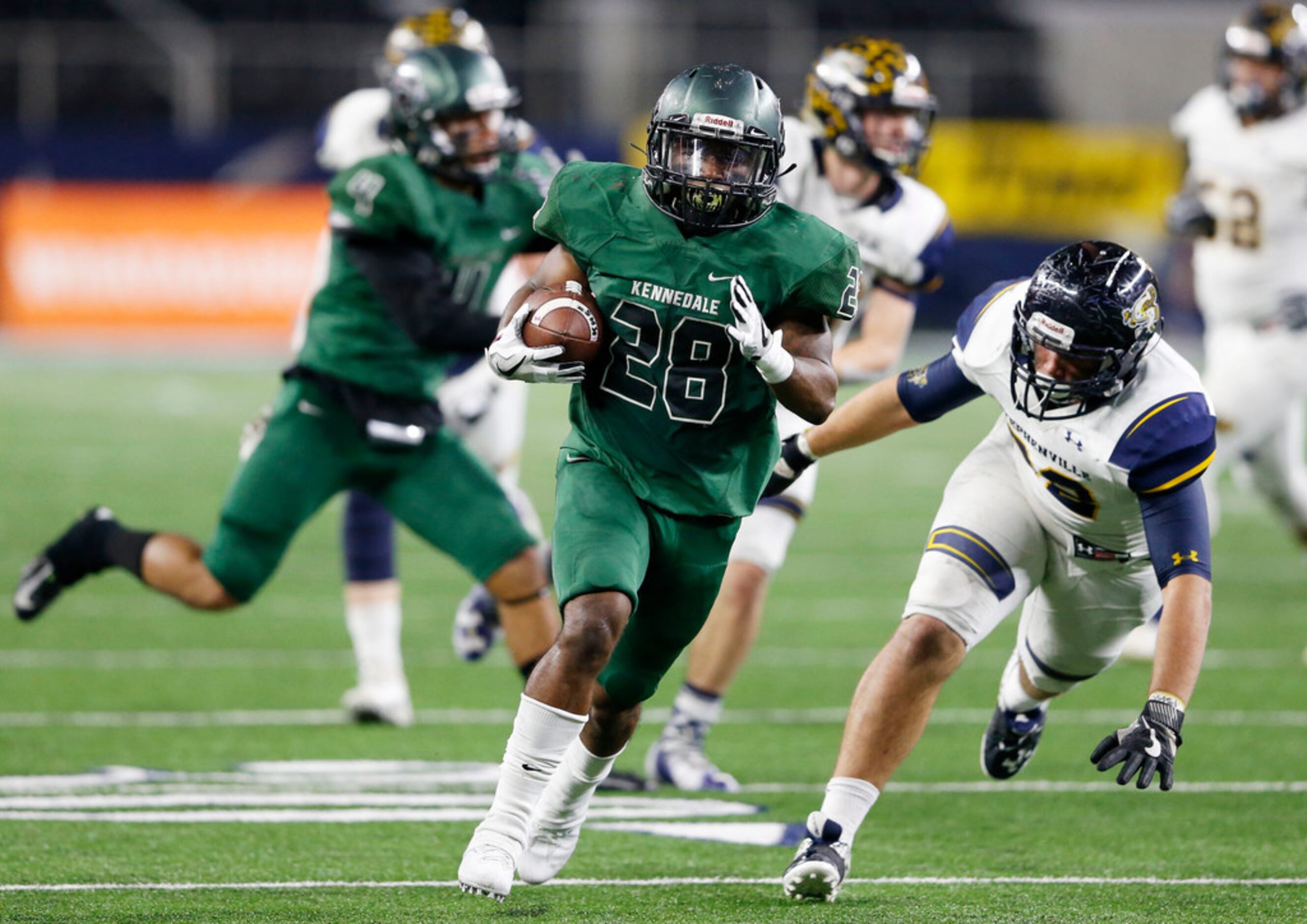 Kennedale's DJ Kirven (28) on his way to the end zone to score a touchdown in a game against...