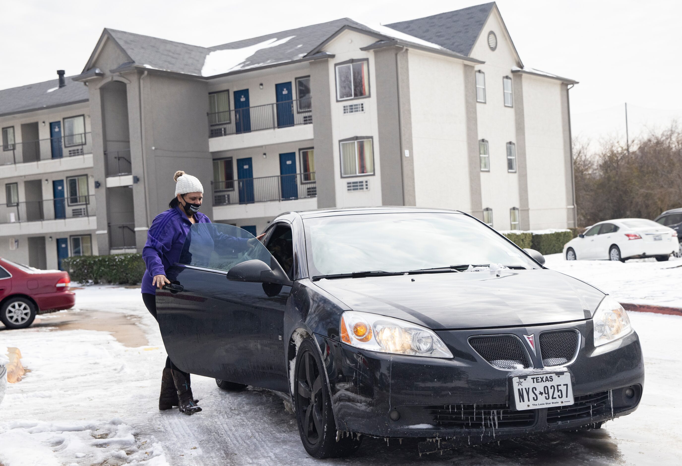 Jammie McGee from Dallas walks back to her car after finding out the Motel 6 in North...