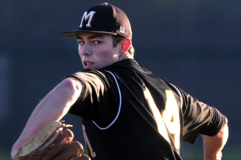 Mansfield senior pitcher Reid Petty (14) delivers a pitch to a Midlothian batter during...