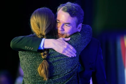 Incumbent Sen. Michael Bennet, D-Colo., right, hugs Morgan Carroll, the state Democratic...