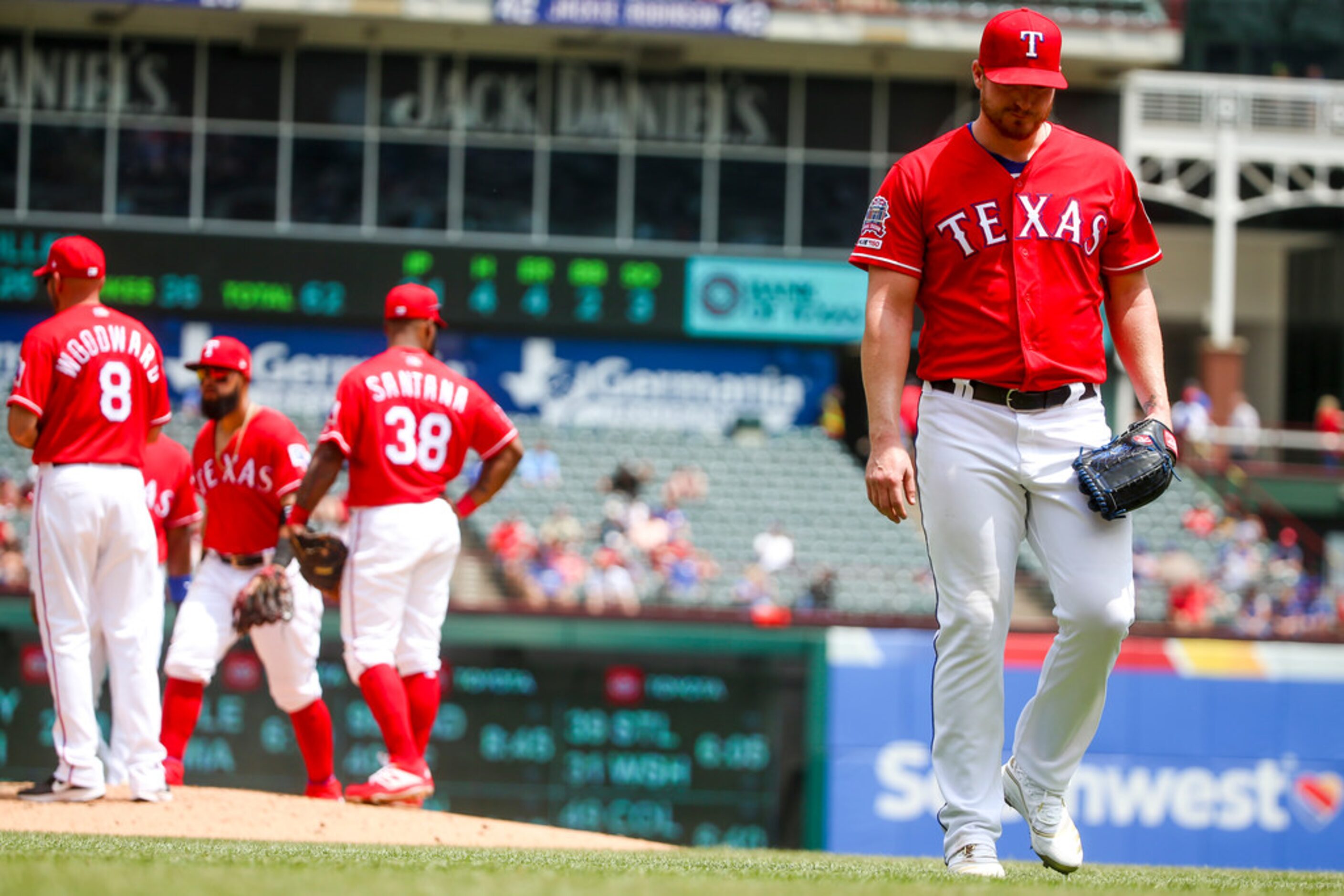 Texas Rangers starting pitcher Shelby Miller (19) walks back to the dugout after manager...