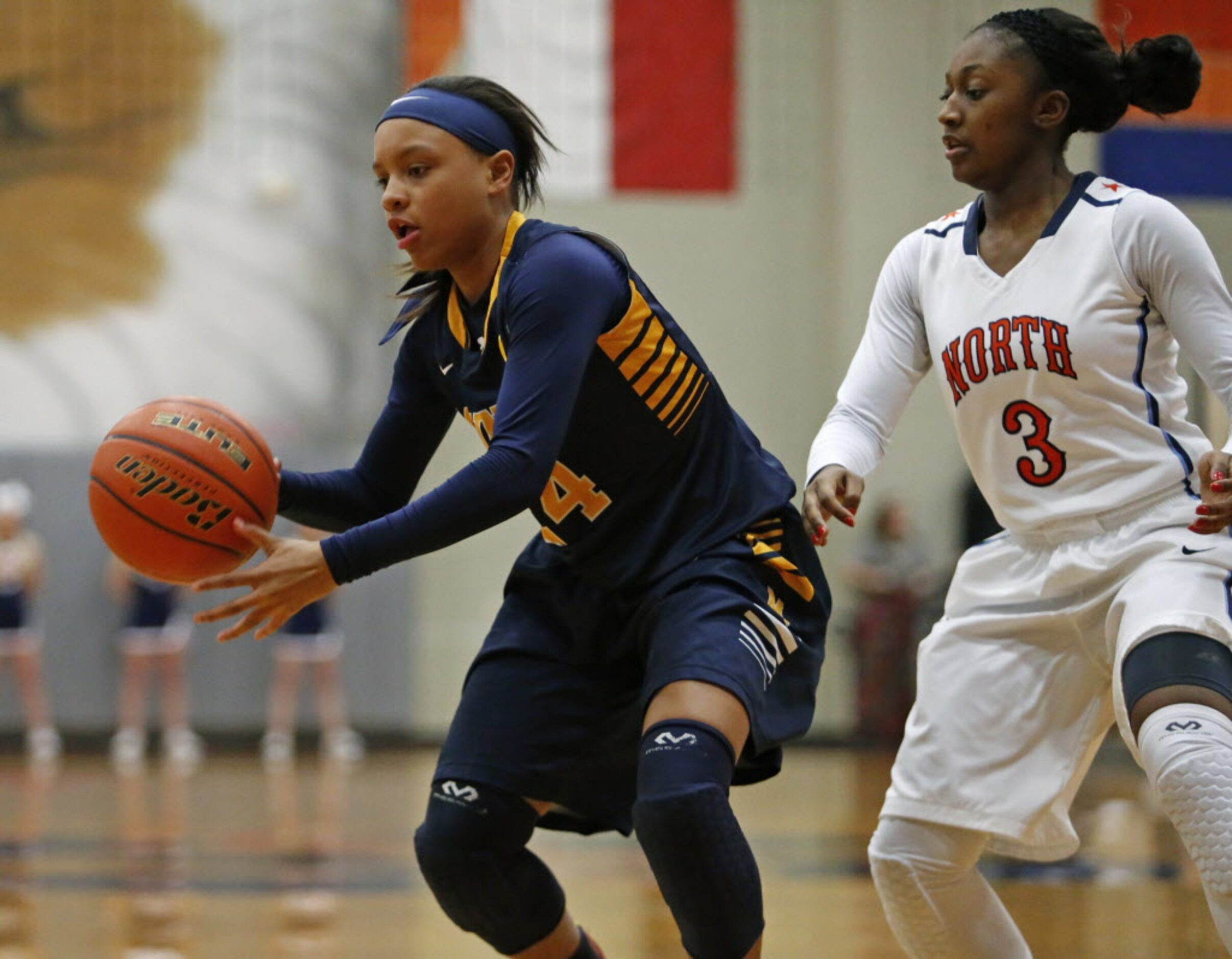 McKinney guard JaMiya Braxton (24) is defended by McKinney North guard Breah Powell during...