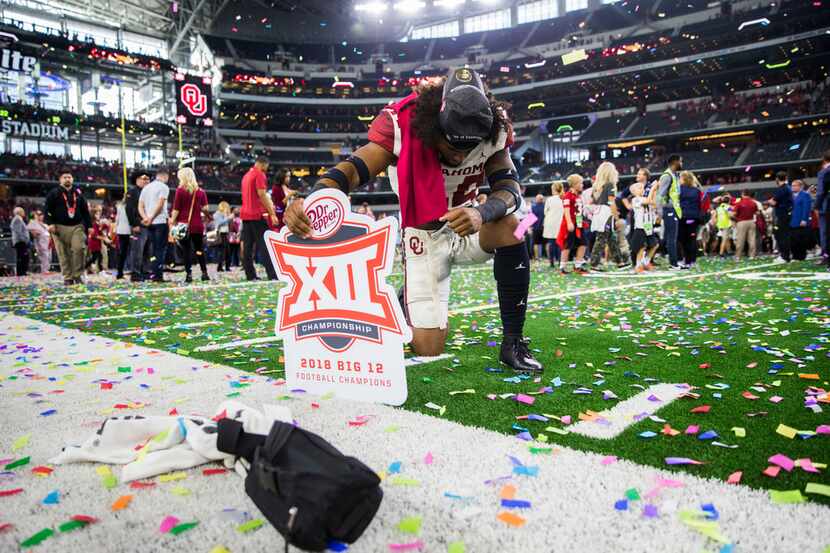 Oklahoma Sooners defensive back Brendan Radley-Hiles (44) kneels on the field after winning...