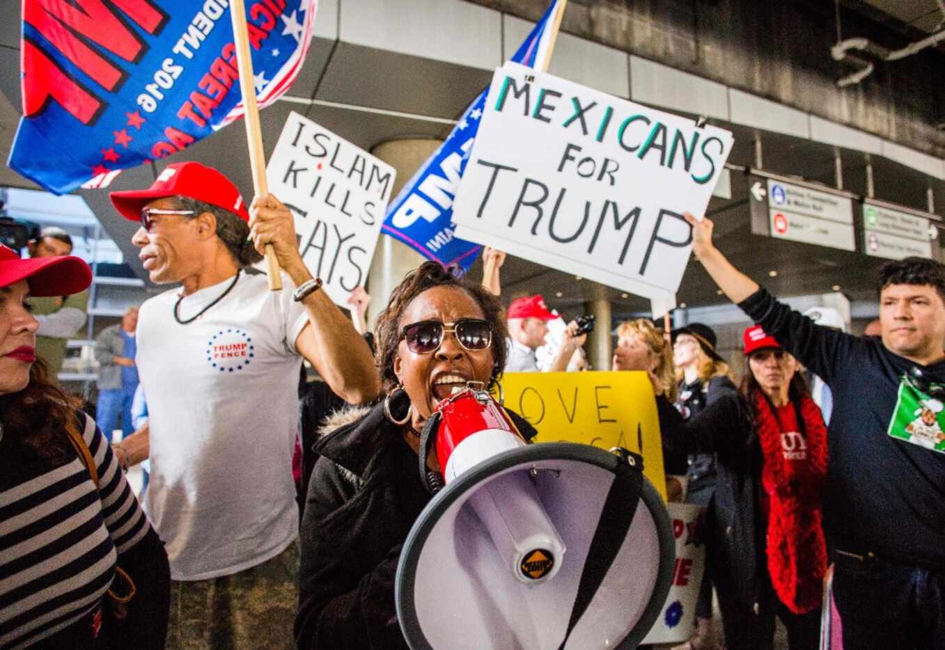 Trump supporter Candace Camper of Los Angeles, California counter-protests the executive...