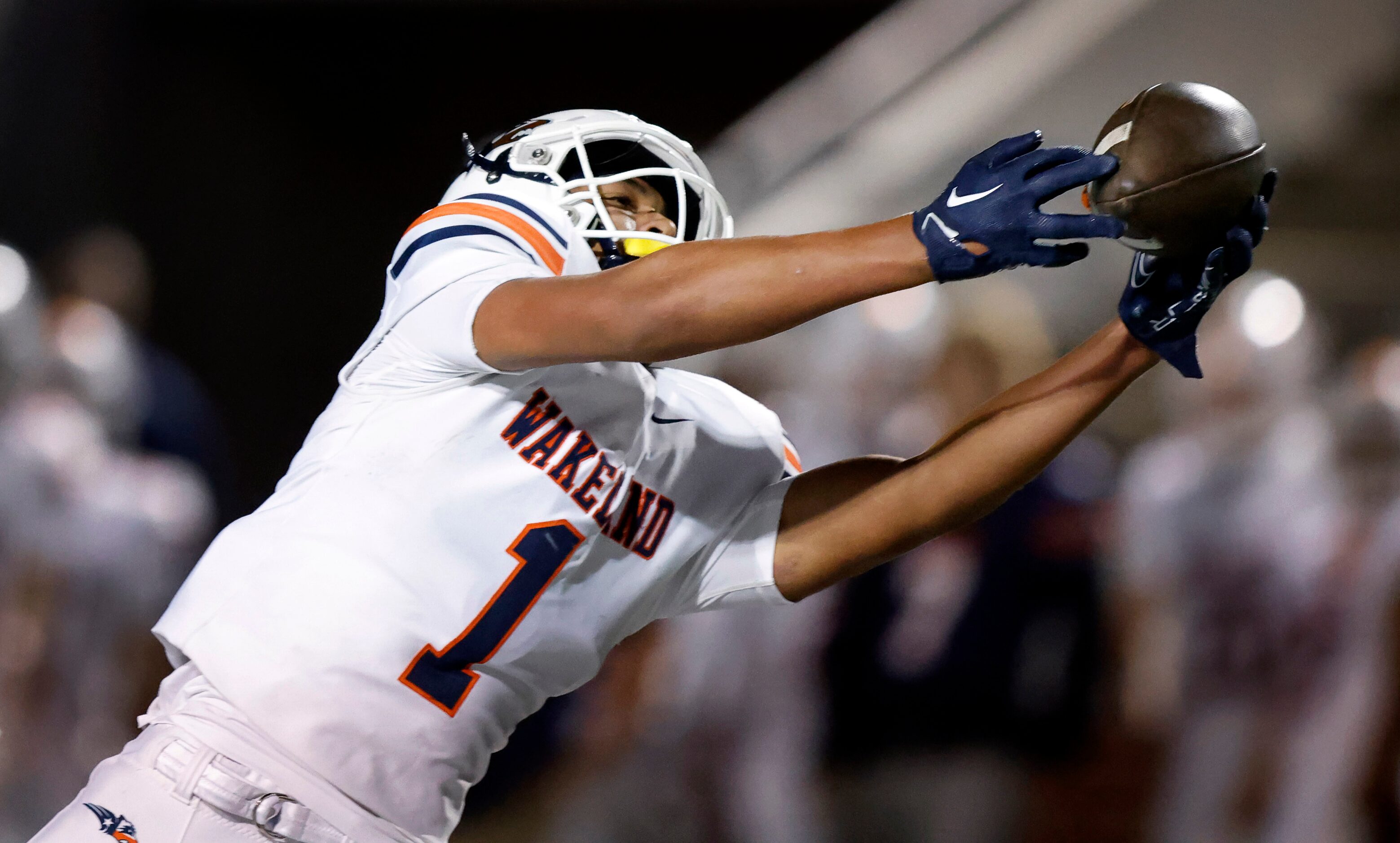 Frisco Wakeland wide receiver Donovan Woolen (1) extends his arms for a first quarter pass...