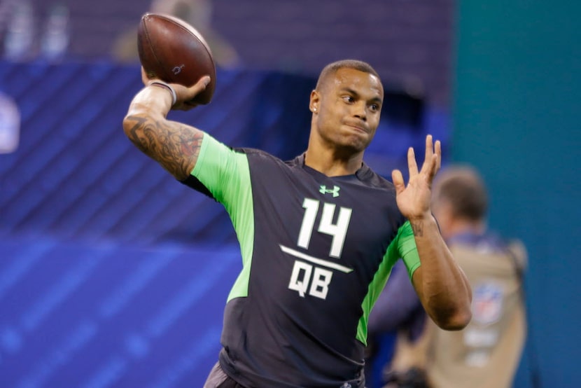 Mississippi State quarterback Dak Prescott runs a drill at the NFL football scouting combine...