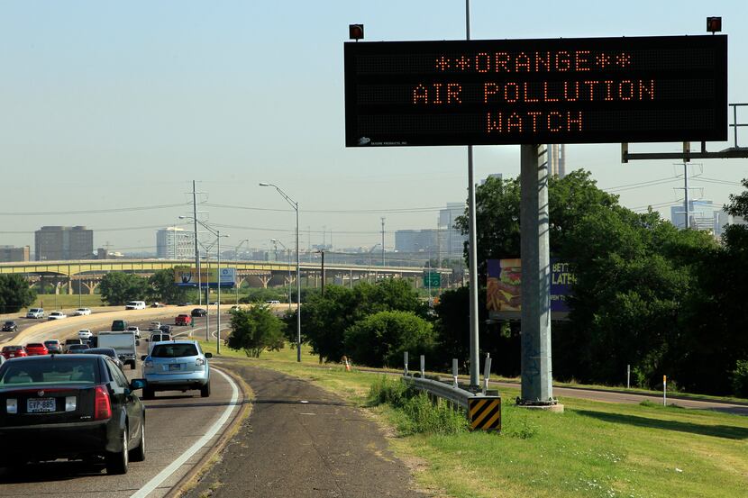 A highway sign alerted drivers on Interstate 35E northbound to air pollution conditions as...