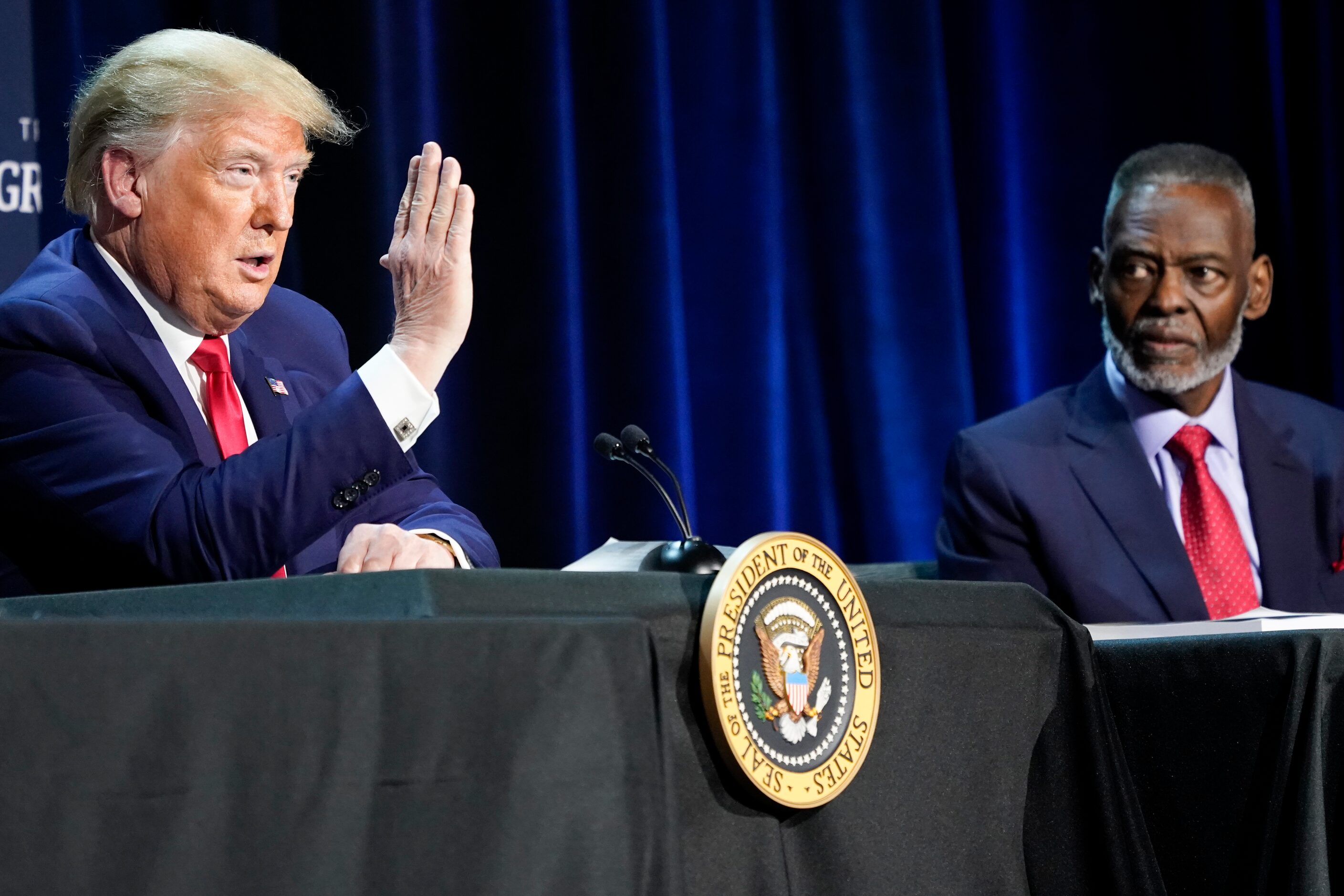 President Donald Trump speaks as Bishop Harry Jackson, senior pastor of Hope Christian...