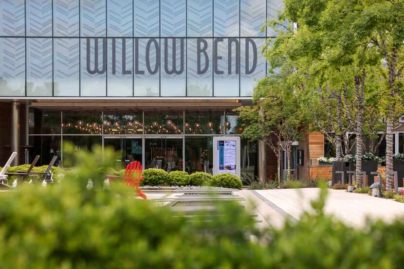 An entrance to The Shops at Willow Bend interior mall from an outdoor restaurant area built...