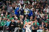 Dallas Mavericks fans celebrates a 3-pointer by guard Luka Doncic during the first half in...