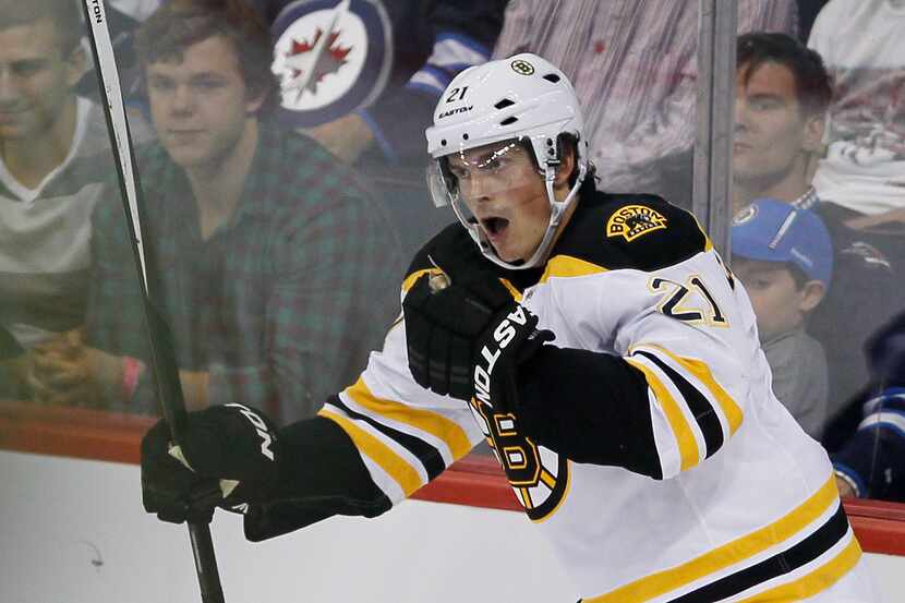 Boston Bruins' Loui Eriksson, of Sweden, celebrates after scoring against the Winnipeg Jets...