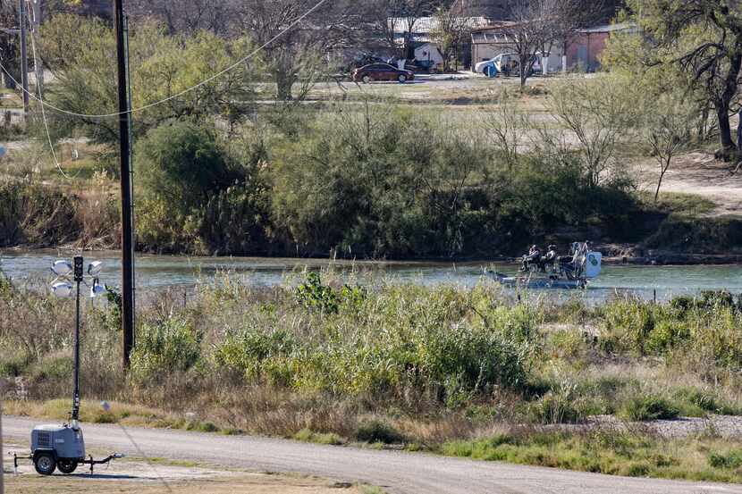 Texas Department of Public Safety officers work inside a fenced off Shelby Park, Thursday,...