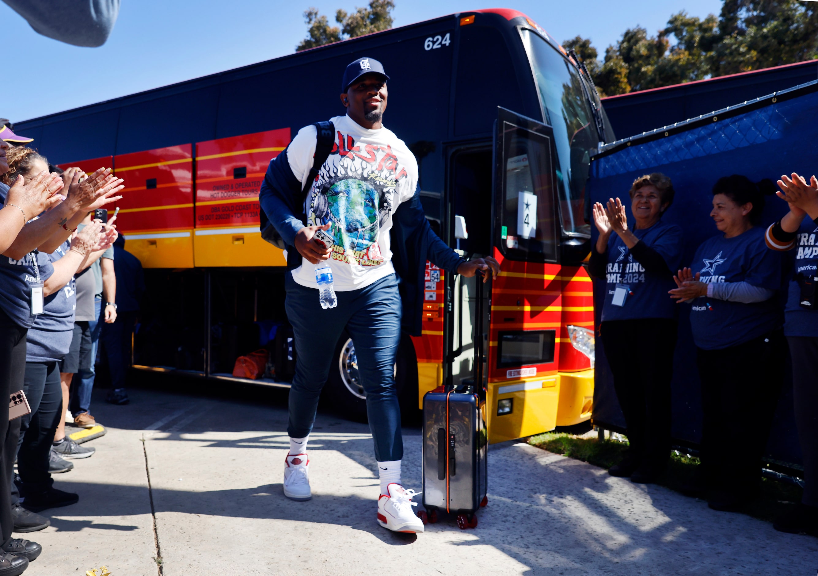 Dallas Cowboys defensive end Chauncey Golston arrives to applause from staff members at the...