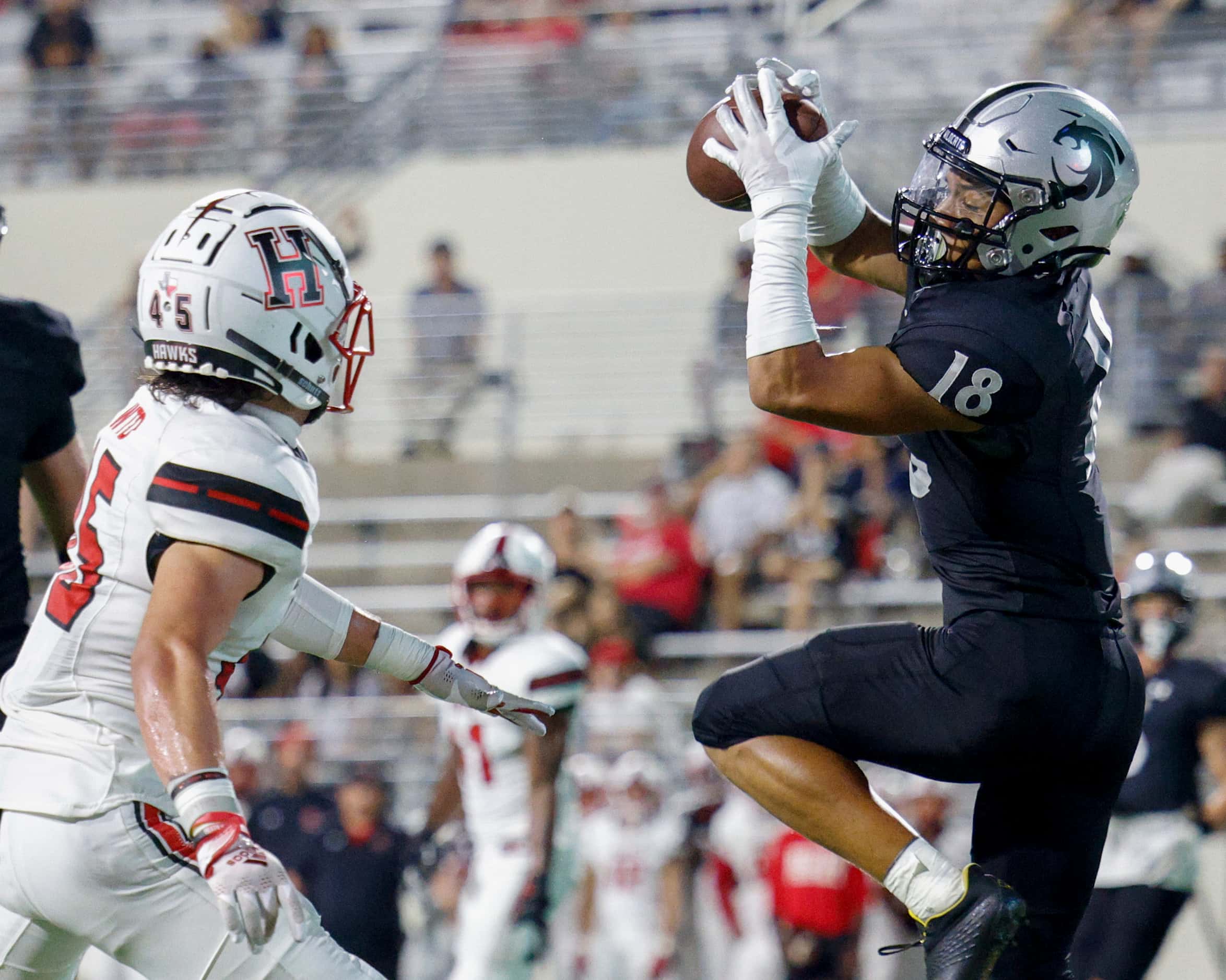 Denton Guyer wide receiver Eli Bown (18) hauls in a catch in the end zone for a touchdown...