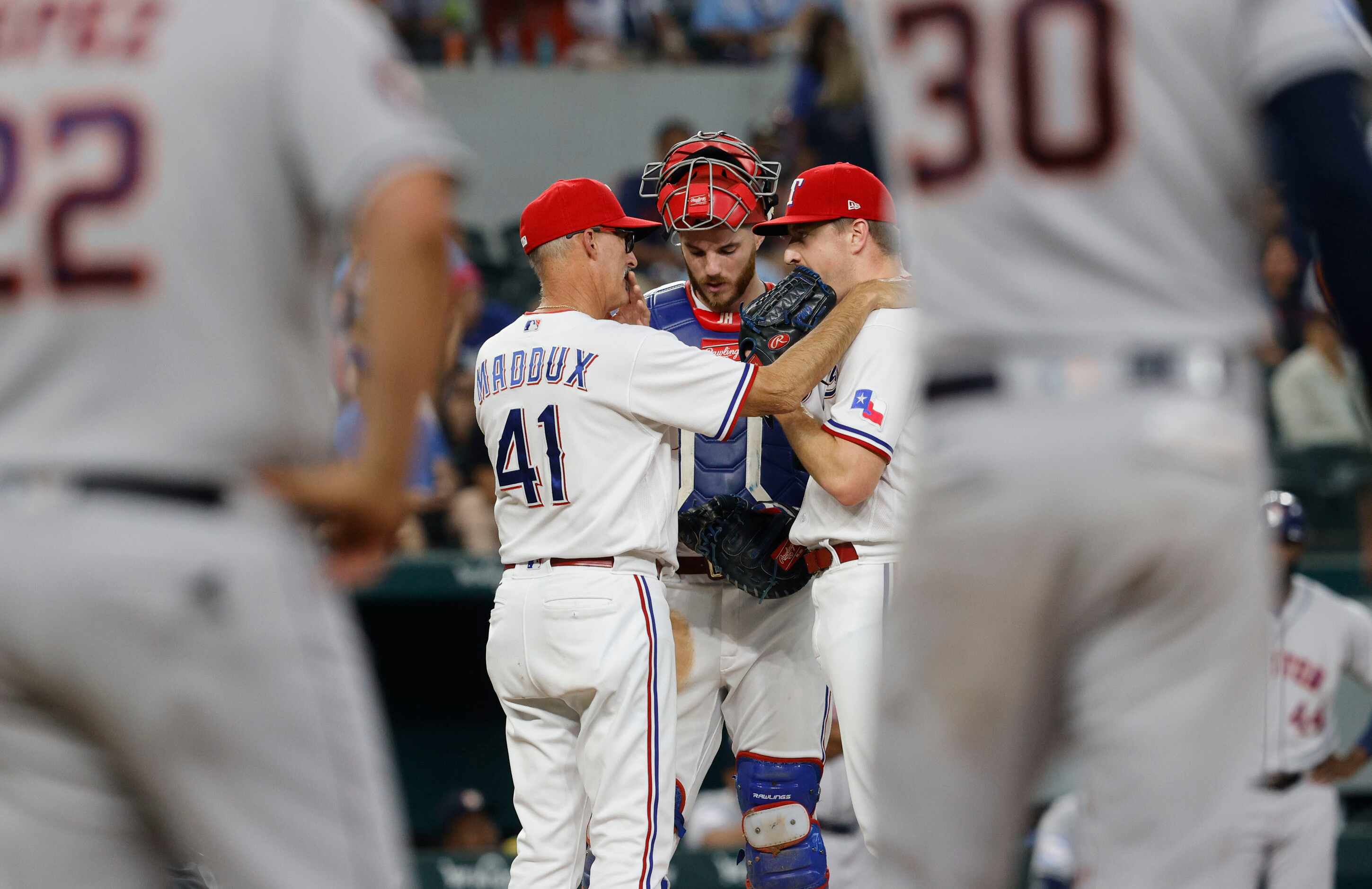 Texas Rangers pitching coach Mike Maddox (41) talks with Texas Rangers relief pitcher Josh...