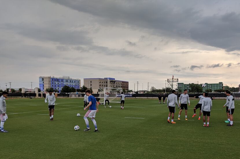 FC Dallas training gets underway under a dark and looming sky. (4-25-18)
