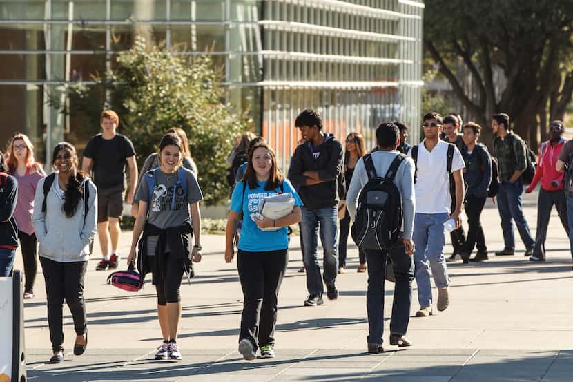Students walk around the University of Texas at Dallas.