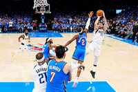 Dallas Mavericks guard Luka Doncic (77) shoots over Oklahoma City Thunder guard Shai...