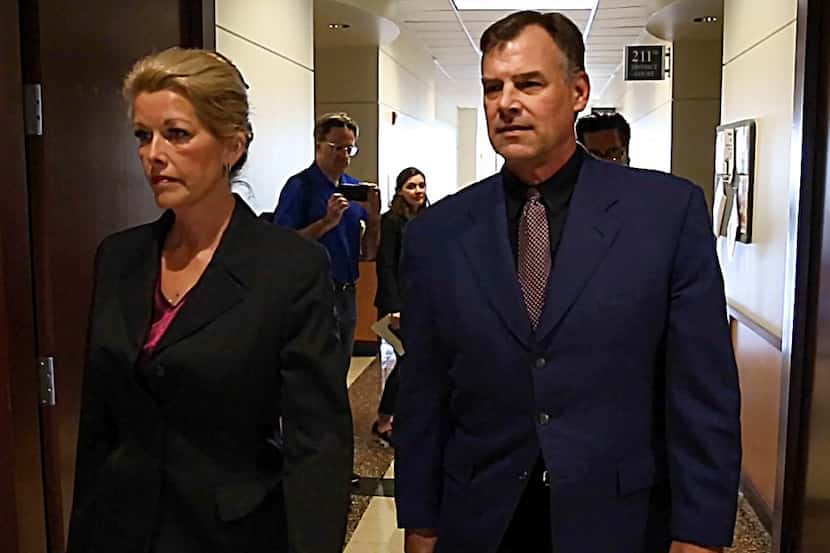 Former Texas Ranger pitcher John Wetteland and his wife Rebecca Wetteland as they leave the...